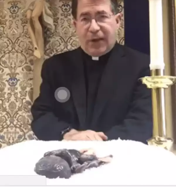 Photo: Catholic priest puts dead fetus on altar to scare people into voting for Trump